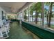 Spacious screened porch with rocking chairs and a view of the lake at 2000 Campbell Rd, Covington, GA 30014