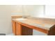 Bathroom vanity with a faux granite countertop, wooden cabinet, and a mirror at 65 Heaton Place Trl, Covington, GA 30016