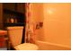 Standard bathroom featuring a toilet, bathtub with shower and floral shower curtain at 65 Heaton Place Trl, Covington, GA 30016