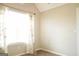 Cozy bedroom with natural light, neutral walls, plush carpet; creating a warm retreat at 65 Heaton Place Trl, Covington, GA 30016