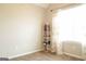 Bedroom with natural light, plush carpet, and a small bookcase to create a cozy ambiance at 65 Heaton Place Trl, Covington, GA 30016