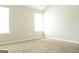 Bright bedroom featuring neutral walls and carpet at 65 Heaton Place Trl, Covington, GA 30016