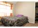 Bedroom featuring carpet, a bed, and natural light at 65 Heaton Place Trl, Covington, GA 30016