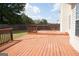 Wide angle of the wood deck highlighting its expansive size and inviting feel at 65 Heaton Place Trl, Covington, GA 30016