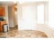 Dining area offers natural light and wainscoting for a cozy, and inviting space for meals at 65 Heaton Place Trl, Covington, GA 30016