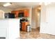 Kitchen featuring oak cabinets, modern appliances and a breakfast bar that opens to the dining area at 65 Heaton Place Trl, Covington, GA 30016