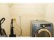 Neat laundry room with a gray Samsung washing machine at 65 Heaton Place Trl, Covington, GA 30016