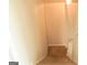 Image shows carpeted stairs leading down, offering a functional and safe way to access lower levels at 65 Heaton Place Trl, Covington, GA 30016