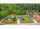 Beautiful aerial view of the home, showcasing the lush landscaping and nearby lake at 447 W Wind Dr, Villa Rica, GA 30180