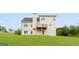 Spacious backyard featuring a multi-level deck and lush green lawn at 447 W Wind Dr, Villa Rica, GA 30180