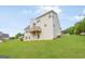 Spacious, grassy backyard with multi-story home and deck at 447 W Wind Dr, Villa Rica, GA 30180