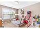Bedroom features a teepee bed, bright window and basketball game at 447 W Wind Dr, Villa Rica, GA 30180