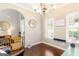 Inviting dining room with a chandelier, large windows, and a built-in display shelf at 447 W Wind Dr, Villa Rica, GA 30180