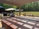 Outdoor living space with a deck, pergola, hot tub, and ample space for entertaining at 1685 Bailey Creek Sw Rd, Conyers, GA 30094