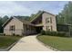 Charming home with light siding, shutters, and a beautifully maintained front yard surrounded by lush trees at 1685 Bailey Creek Sw Rd, Conyers, GA 30094