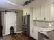Modern kitchen features shaker cabinets, stainless steel refrigerator, and subway tile backsplash at 1685 Bailey Creek Sw Rd, Conyers, GA 30094