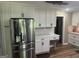 Modern kitchen features shaker cabinets, stainless steel refrigerator, and subway tile backsplash at 1685 Bailey Creek Sw Rd, Conyers, GA 30094