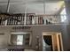 Open concept living room with exposed beams and staircase and fireplace at 1685 Bailey Creek Sw Rd, Conyers, GA 30094