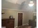 Comfortable main bedroom with neutral walls, dresser, and a window with blinds for privacy at 1685 Bailey Creek Sw Rd, Conyers, GA 30094