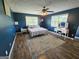 Serene bedroom with ample natural light, plush carpeting, and stylish decor, ideal for relaxation and restful sleep at 140 Whitehead Sw Rd, Oxford, GA 30054