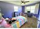 Bright bedroom featuring a bed, carpet flooring, and natural light at 140 Whitehead Sw Rd, Oxford, GA 30054