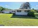 A cozy single-story home with a well-maintained lawn, complemented by a detached garage at 140 Whitehead Sw Rd, Oxford, GA 30054