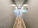 Hallway with hardwood flooring and neutral paint at 140 Whitehead Sw Rd, Oxford, GA 30054