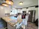 Modern kitchen featuring granite countertops, stainless steel appliances, and updated cabinetry at 140 Whitehead Sw Rd, Oxford, GA 30054