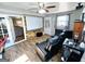 Cozy living room with a large movie screen, comfortable seating, and unique wood accent wall, perfect for relaxation at 140 Whitehead Sw Rd, Oxford, GA 30054