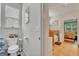 This bathroom features a neutral color scheme and views of the Primary bedroom at 228 Madison Grace Ave, Mcdonough, GA 30252