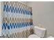 Full bathroom with a stylish shower curtain at 228 Madison Grace Ave, Mcdonough, GA 30252