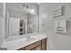 Well-lit bathroom featuring a large mirror and classic vanity at 228 Madison Grace Ave, Mcdonough, GA 30252