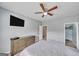 Cozy bedroom with neutral walls, ceiling fan, and a walk-in closet at 228 Madison Grace Ave, Mcdonough, GA 30252