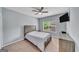 Bedroom featuring a large window with natural light and a modern ceiling fan at 228 Madison Grace Ave, Mcdonough, GA 30252