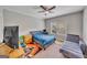 Comfortable bedroom with a window providing natural light and a ceiling fan at 228 Madison Grace Ave, Mcdonough, GA 30252