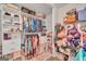 Walk-in closet featuring custom shelving and ample storage for clothes, shoes, and accessories at 228 Madison Grace Ave, Mcdonough, GA 30252