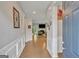 Inviting entryway with hardwood floors, decorative wall trim, and an open view into the living area at 228 Madison Grace Ave, Mcdonough, GA 30252