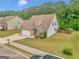 Charming two-story home featuring brick and stone accents, with a two-car garage at 228 Madison Grace Ave, Mcdonough, GA 30252