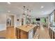 Large kitchen island with granite countertops, stainless steel appliances, and an open concept design at 228 Madison Grace Ave, Mcdonough, GA 30252