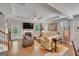 Inviting living room features hardwood floors, a fireplace, and a door leading to the outdoors at 228 Madison Grace Ave, Mcdonough, GA 30252