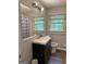 Bathroom with updated vanity, two windows and updated lighting at 260 Pinehurst Dr, Stockbridge, GA 30281