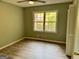 Bedroom featuring a large window and closet at 260 Pinehurst Dr, Stockbridge, GA 30281