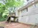 A view of the side of the house with the deck, and chimney at 260 Pinehurst Dr, Stockbridge, GA 30281