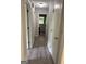 Hallway with access to bedrooms and bathroom and luxury vinyl plank flooring at 260 Pinehurst Dr, Stockbridge, GA 30281