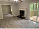 Spacious living room with a fireplace and sliding glass doors leading to a deck at 260 Pinehurst Dr, Stockbridge, GA 30281