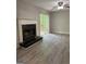 Living room with a fireplace and access to a deck through sliding glass doors at 260 Pinehurst Dr, Stockbridge, GA 30281