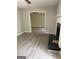 Spacious living room features a fireplace and leads to another room with a ceiling fan at 260 Pinehurst Dr, Stockbridge, GA 30281