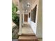 Covered porch with white columns and black shuttered windows at 260 Pinehurst Dr, Stockbridge, GA 30281