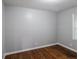 Bedroom with hardwood flooring, light gray walls, and a window at 3903 Rex Rd, Rex, GA 30273