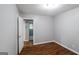 Bedroom with hardwood flooring and a doorway that provides access to other rooms at 3903 Rex Rd, Rex, GA 30273